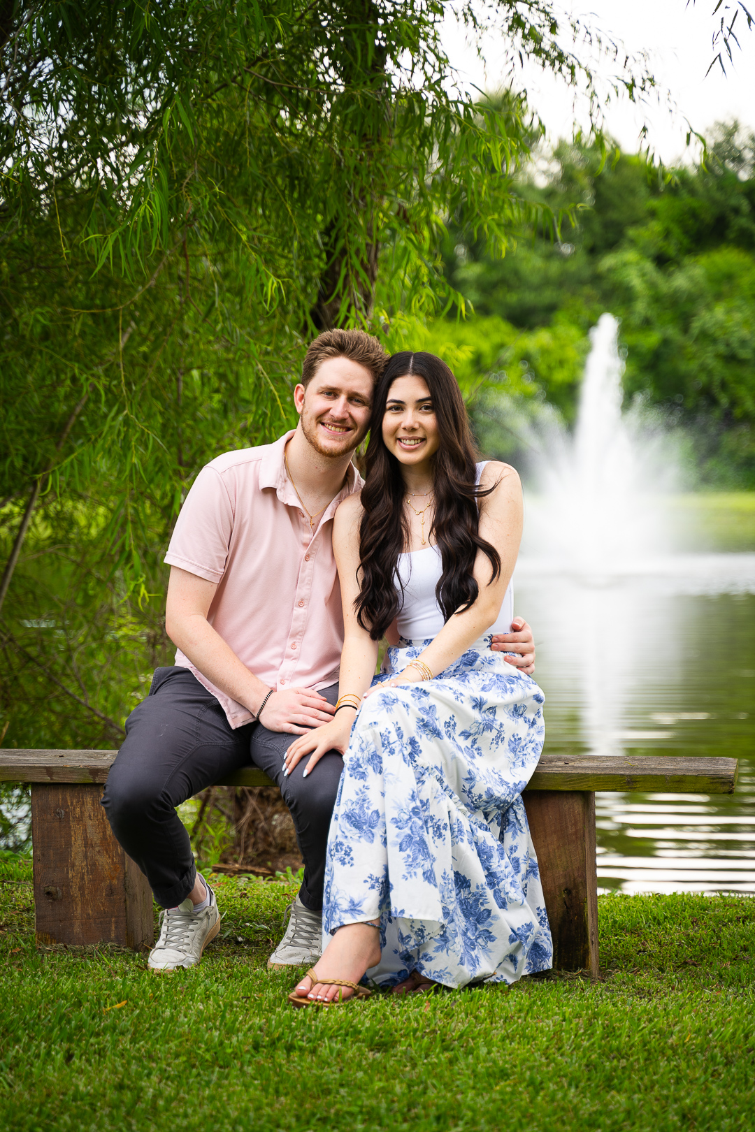 Engagement session with young couple near water fountain at lake in Baton Rouge, LA.