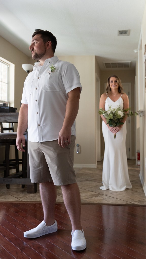 Bride and groom during first look photos at Gautier, MS getting ready location 
