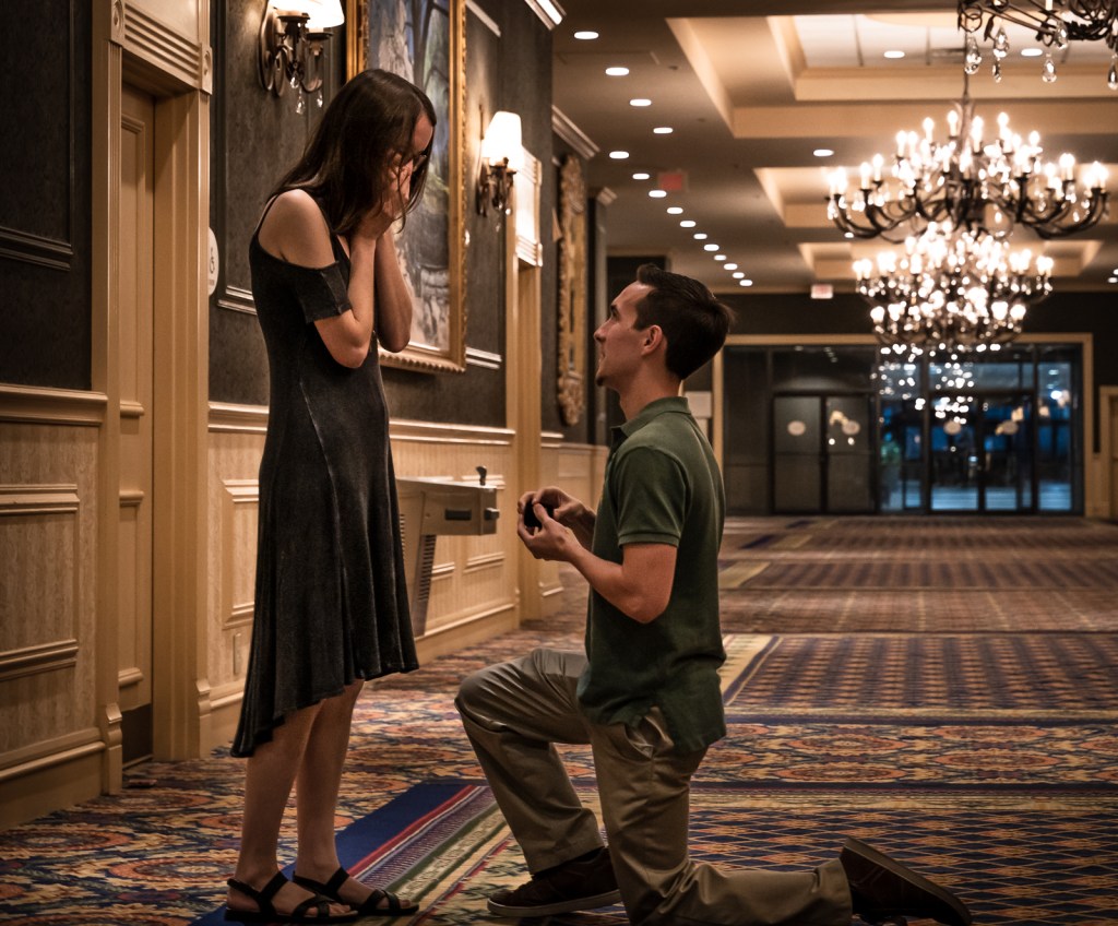 Boyfriend romantically proposing to his girlfriend at a fancy hotel in Jackson, MS. 