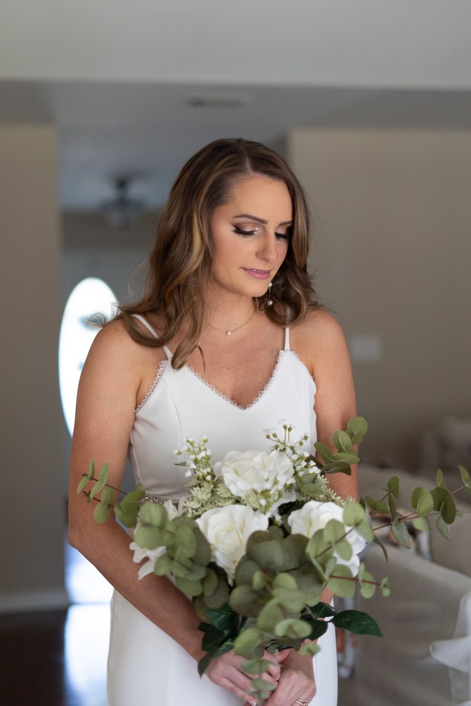 timeless pictures of bride in dress with wedding flowers 