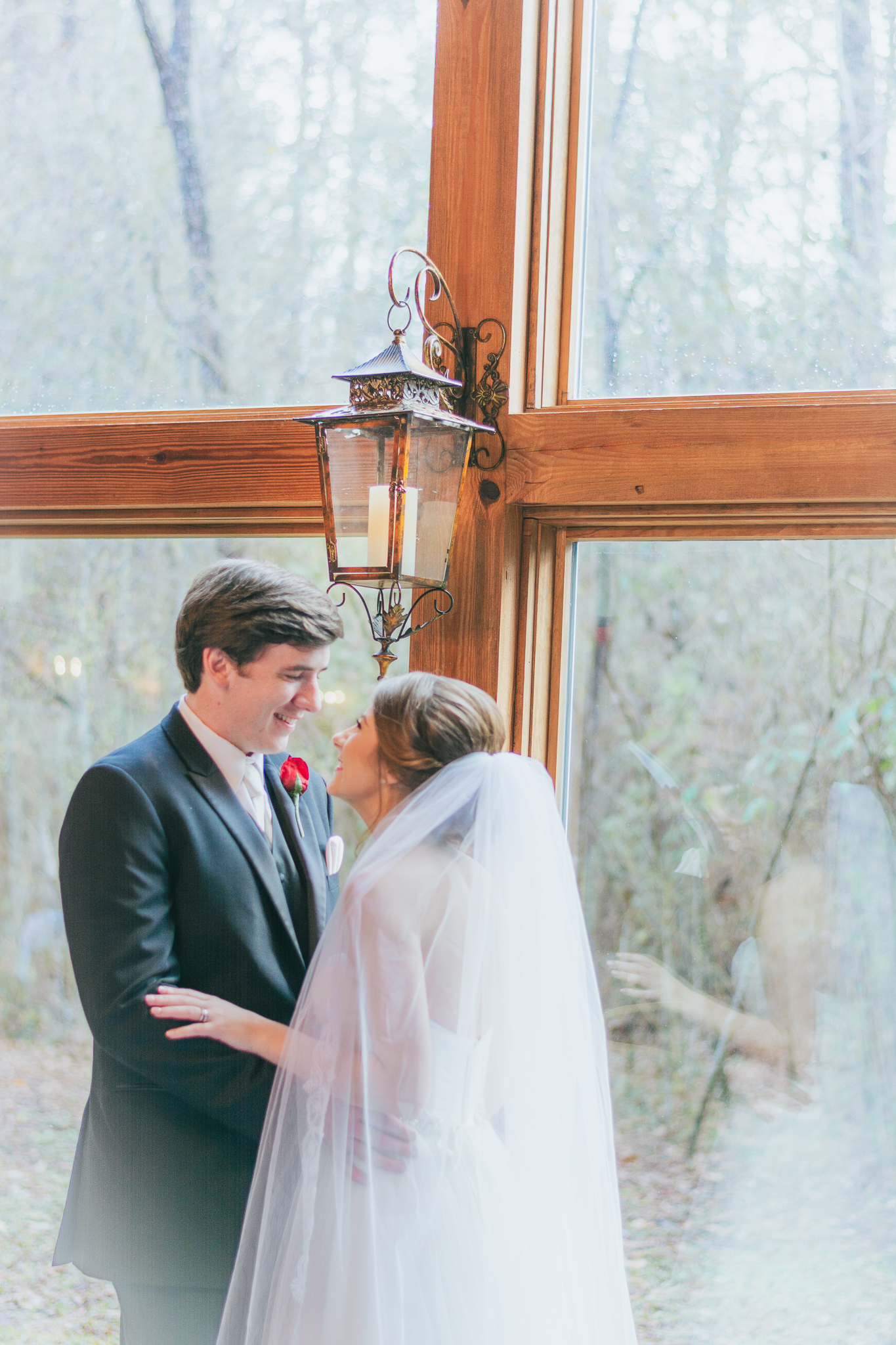 Bride and groom looking longingly into each others eyes at a wedding venue in Mississippi. 