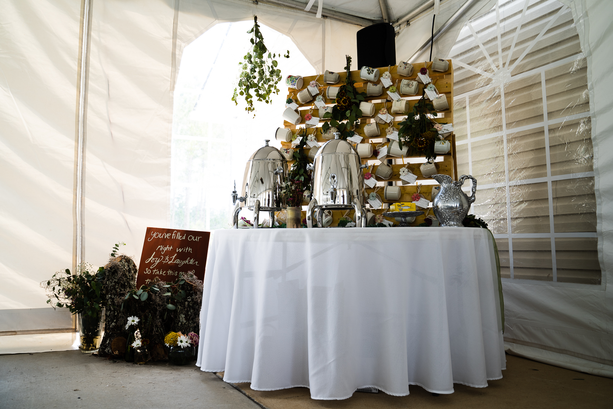 Coffee bar with coffee cup favors at Christian wedding