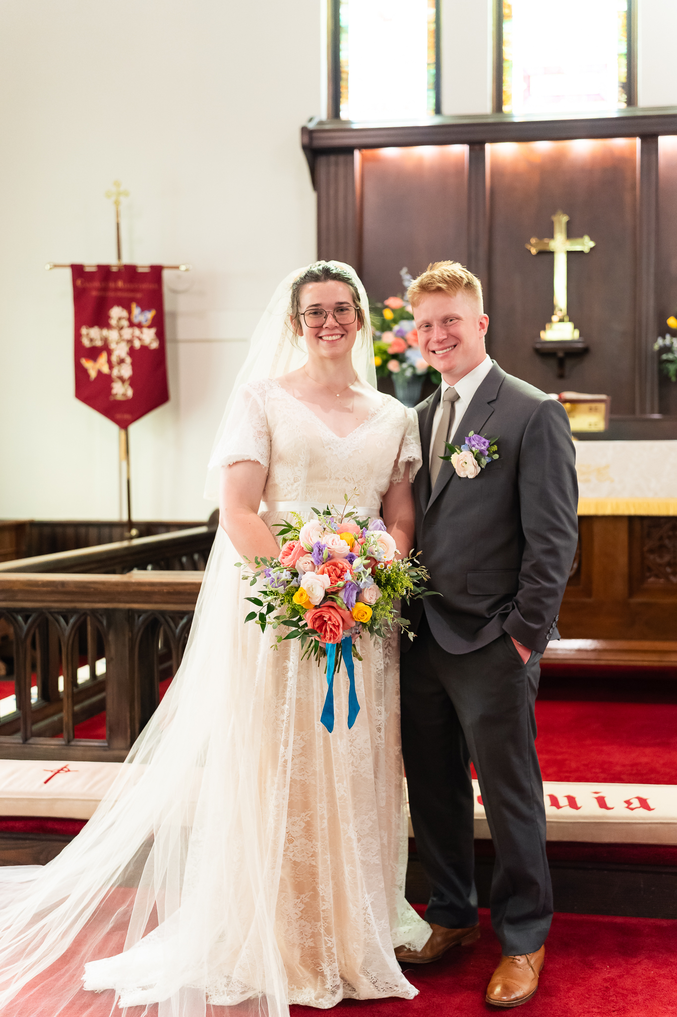 Mississippi Bride and Groom in front of cross at church wedding