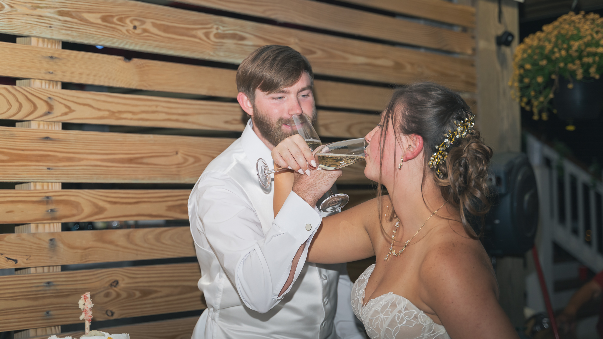 bride and groom having a drink together